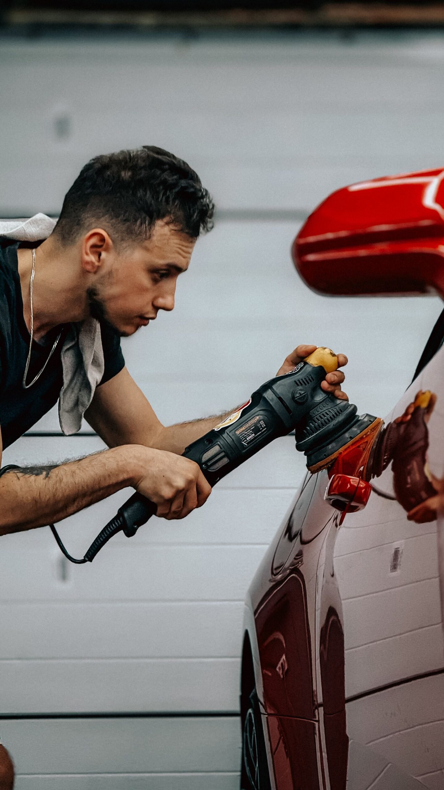 Machine polishing a car's paint